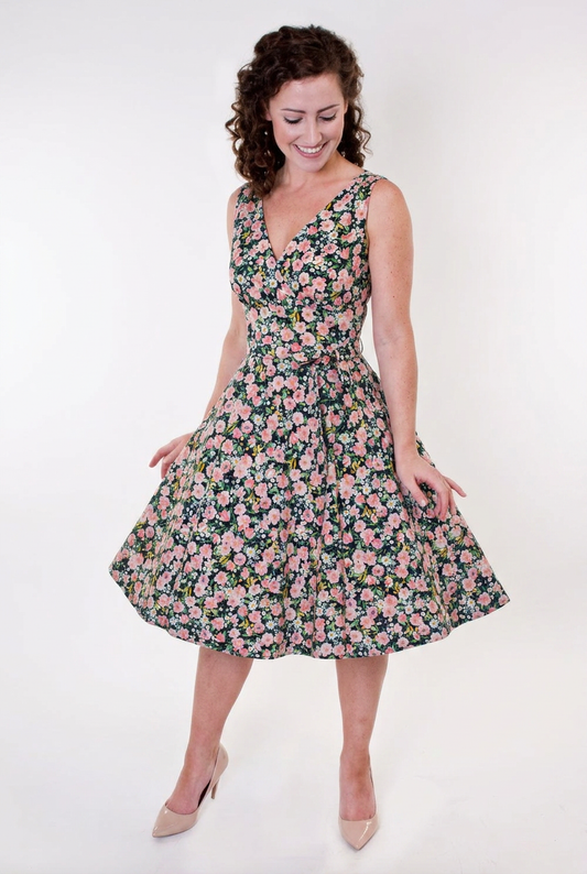 Woman wearing a floral dress on a white background